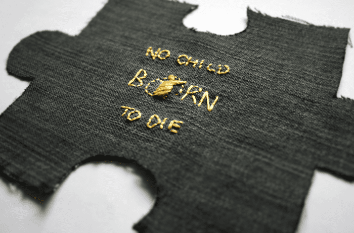 No Child Born to Die embroidered jigsaw piece for #imapiece
