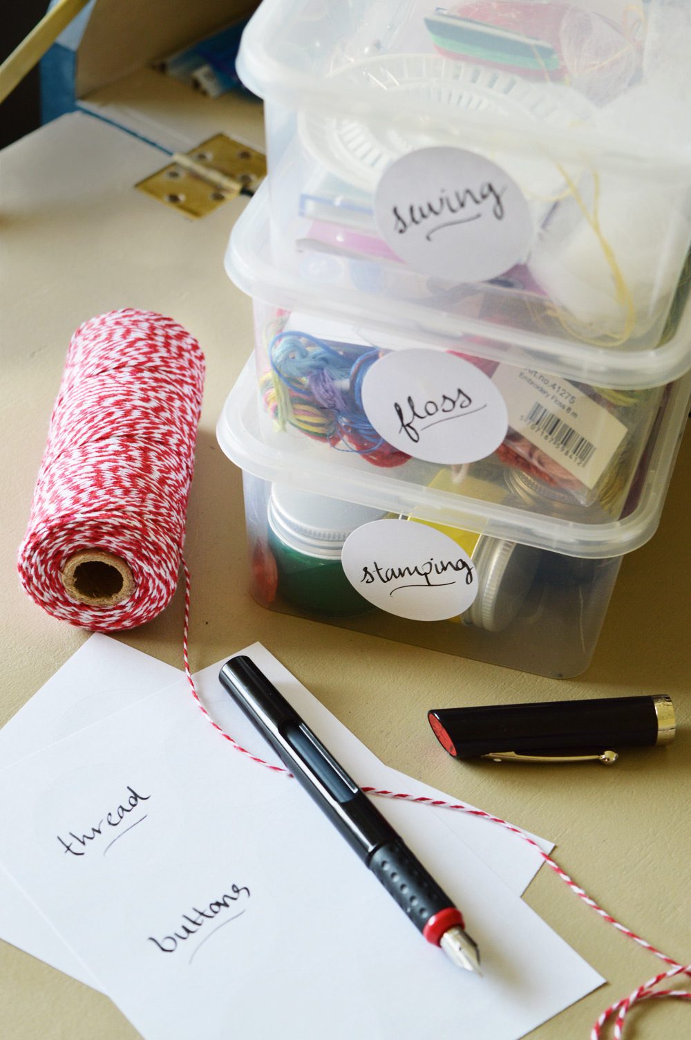 Organising craft materials with handwritten labels 